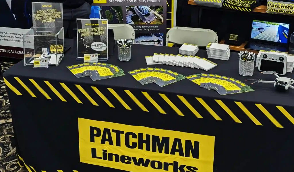Patchman Lineworks Tradeshow setup (tablecloth, pamphlets, banner, swag)